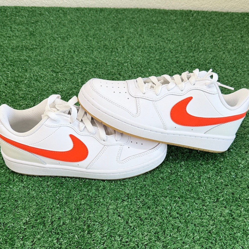 Nike Kids White Sneakers with Orange Swoosh